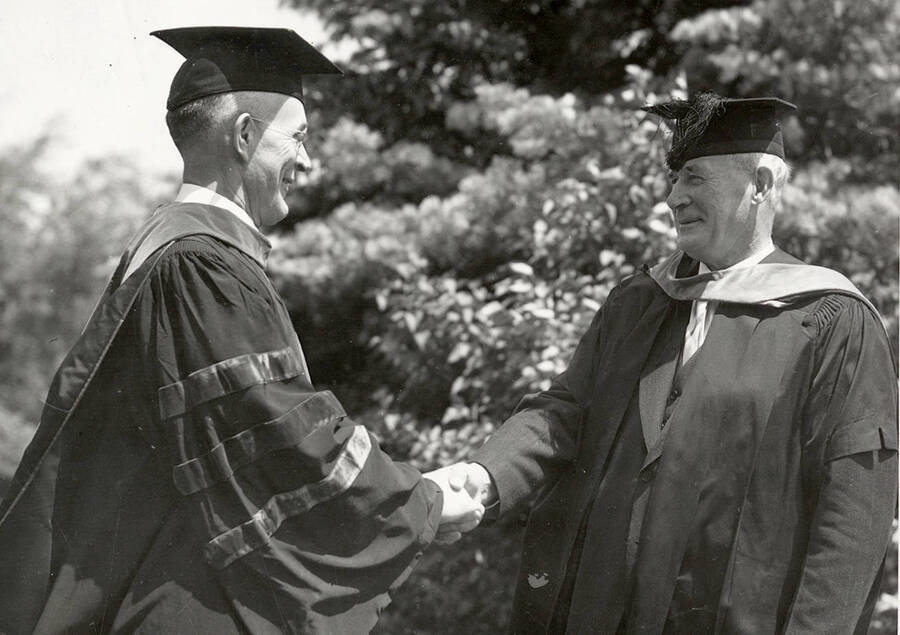 Dean Jeffers (left) congratulating Richard H. Rutledge as he receiving an honorary degree during Commencement.
