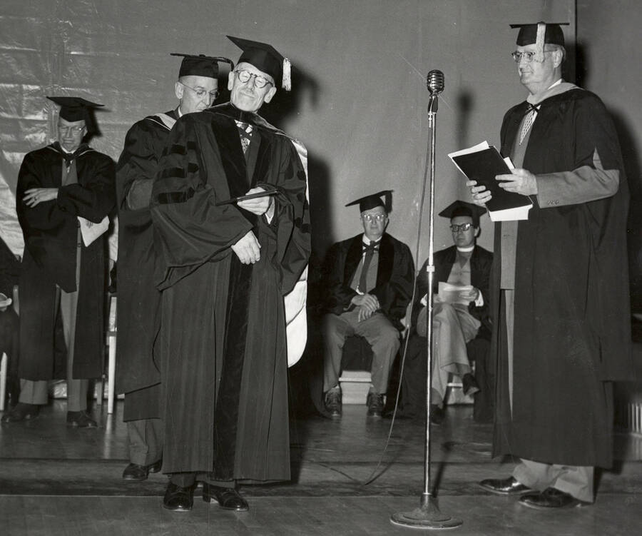 Laurence Gipson, One of Idaho's first two Rhodes scholars, receiving an honorary Doctorate degree from University of Idaho President Jesse Buchanan during the 1953 Commencement ceremony.