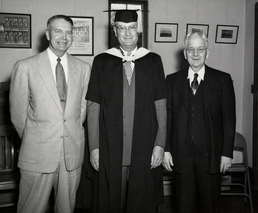 Governor Len Jordan stands with Uuniversity of Idaho President Jesse Buchanan and James E. Graham for the 1953 Commencement ceremony.