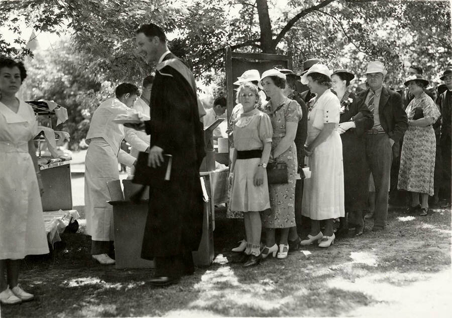 Guests attend an outdoor luncheon for the 1938 Commencement.