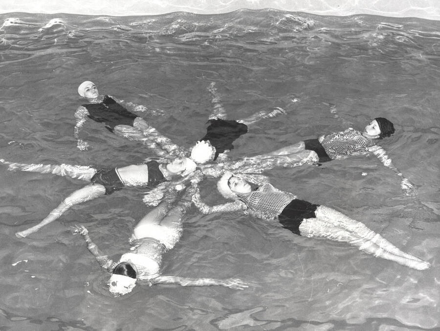 Diana Kinzer, Kay Barnes, Swen Hyke, Nancy Knox, Marcia Gellert, and Maureen Snow perform in the Helldiver's swimming club program 'Moods of Music.' Individuals are identified clockwise from top