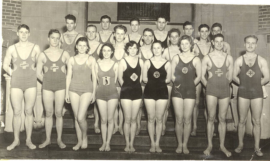 Members of the Helldiver's swimming club pose for a group photograph on the stairs inside Memorial Gymnasium.