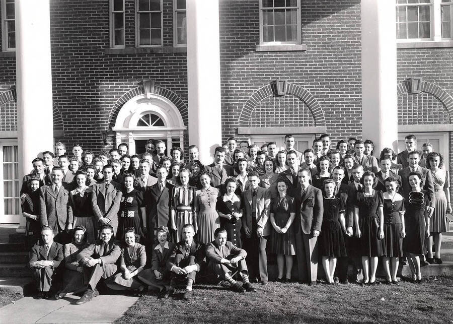 Students pose for a photograph outside the Kappa Sigma house before a formal dance.