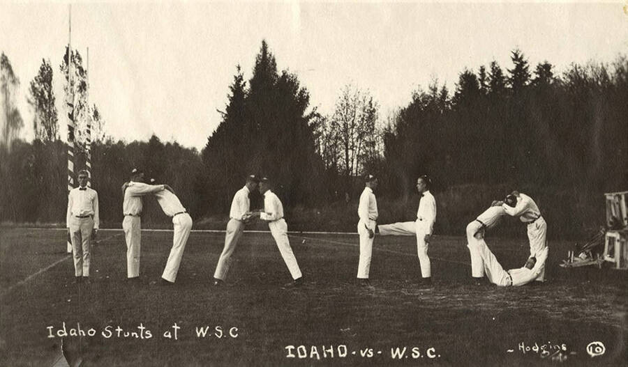 Yell Kings and Dukes participate in the Idaho Stunt as part of the Harvard Yell Contest during a football game. Caption reads: Idaho Stunts at W.S.C., Idaho vs. W.S.C. #10.