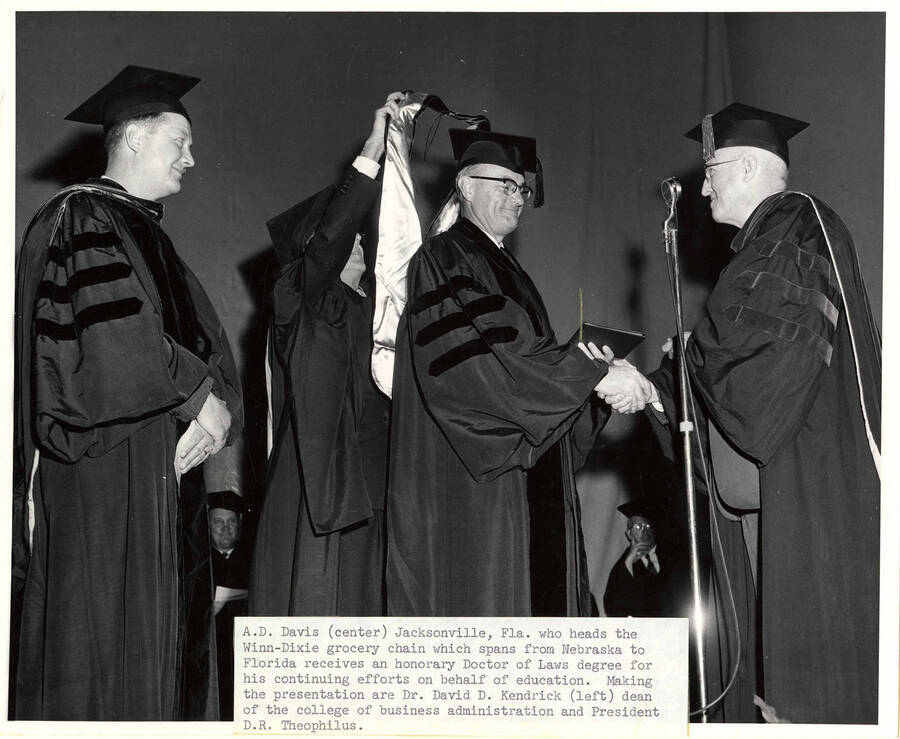 A.D. Davis receiving an honorary Doctor of Laws degree from Dr. David D. Kendrick, dean of the college of Business Administration, and University of Idaho President Donald Theophilus during the 1961 Commencement. Photographer Publications Department