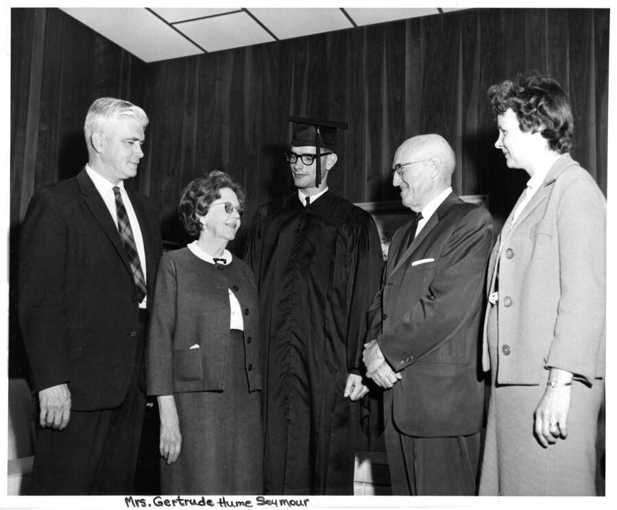 Mr. Allen, Gertrude Seymour, Hugh Allen, University of Idaho President Donald Theophilus and Mrs. Allen speak together for the 1964 Commencement.