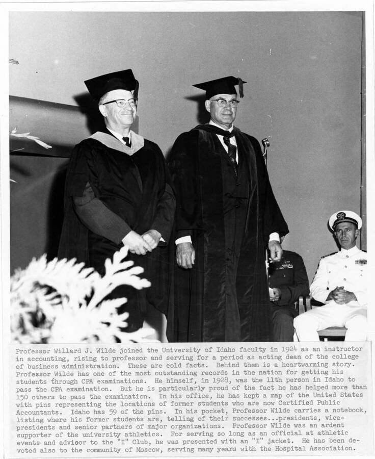 Professor Willard J. Wilde (left) upon his retirement during the 1964 Commencement ceremony. Photographer Publications Department