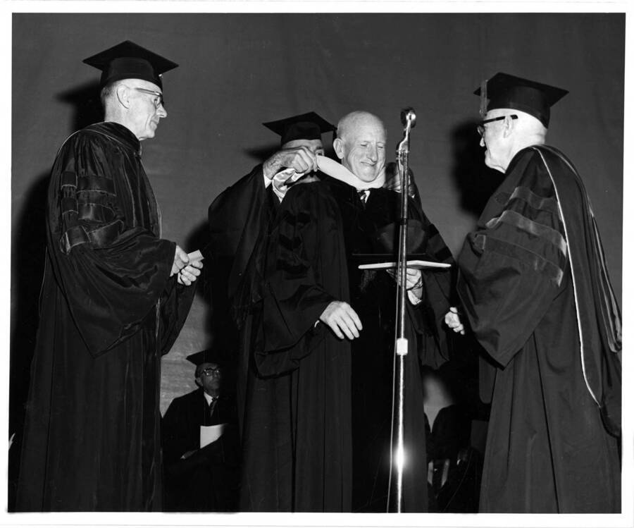 Charles A. Connaughton receives an honorary Doctorage degree during the 1965 Commencement ceremony. Photographer Publications Department
