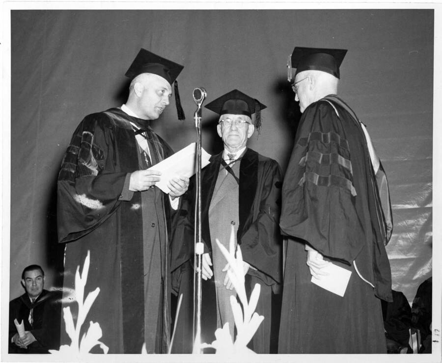 James Herrick Gipson, Sr., president of Caxton Printers, receives an honorary degree during the 1956 Commencement ceremony. Photographer Publications Department