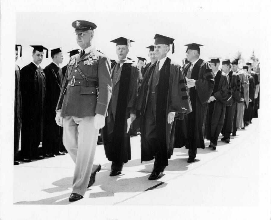 Lt. Colonel Charles W. Jones leading the procession for the 1941 Commencement. Also shown is University of Idaho President Harrison C. Dale