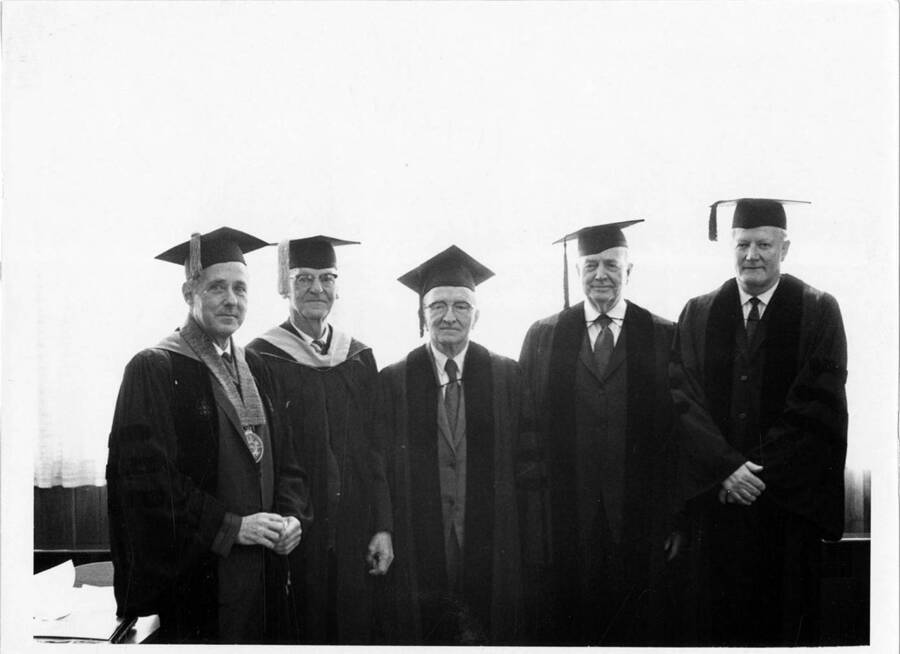 University of Idaho President Ernest W. Hartung with those receiving an honorary Doctoral degree; (from left) Arthur W. Fahrenwald, A. J. Gustin Priest, Senator Len B. Jordan, and George Brunzell. Commencement.