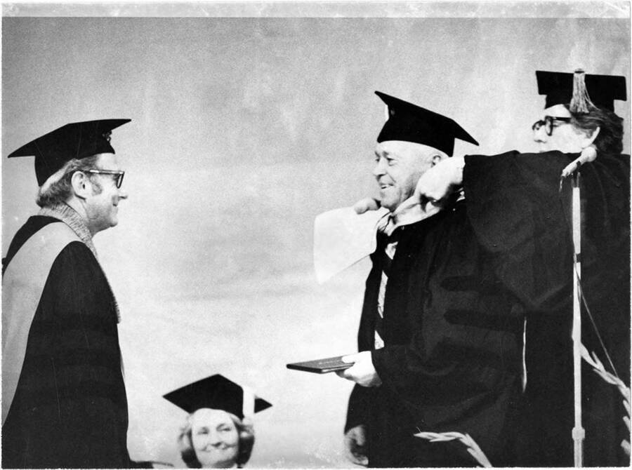 J.R. Simplot, chairman of the board and founder of J.R. Simplot Co., receives an honorary Doctor of Administrative Science degree during the 1975 Commencement ceremony.