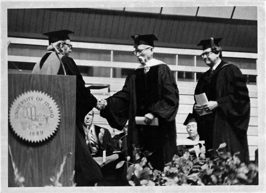 Dr. Malcolm M. Renfrew receiving an honorary Doctor of Science degree during the 1976 Commencement ceremony.