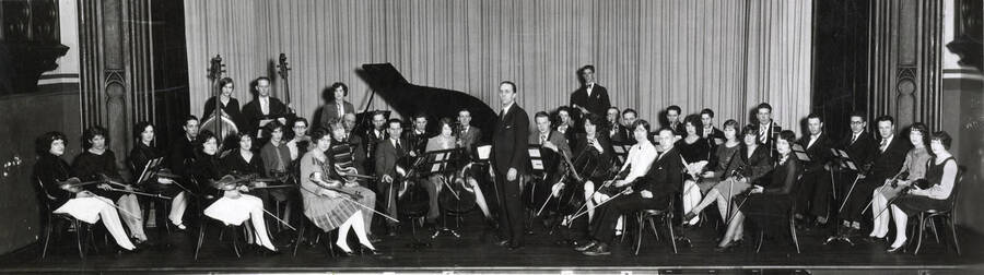 A group picture of the University Orchestra of 1927-1928, under the direction of Professor Carl Claus.