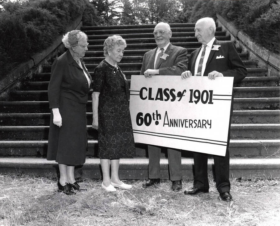 Members of the Class of 1901 pose for their 60th anniversary photo by the stairs to Old Administration Building. Pictured from left to right: Carrie Tomer Hays, Minnie Galbreath Marcy, Homer David and Carroll Smith.