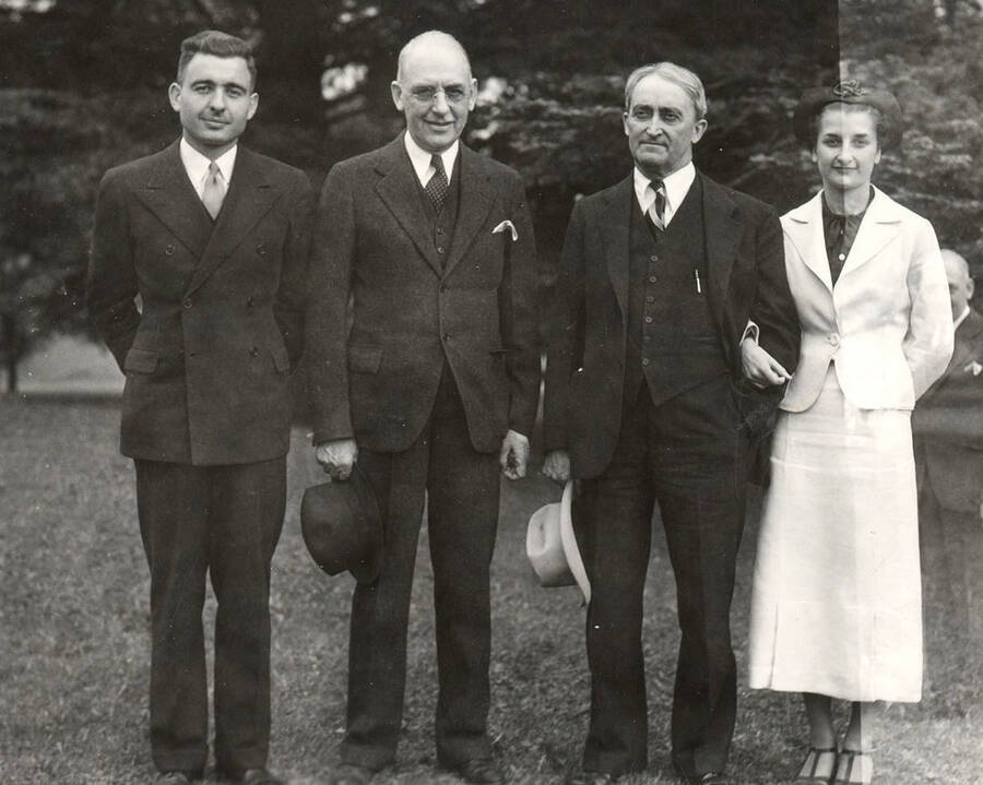 Homer David and Gub Mix pose for a photograph with members of their family as part of the class of 1901 35th reunion. Identified left to right: Franklin David, Homer David, Gub Mix, and Betty Mix.