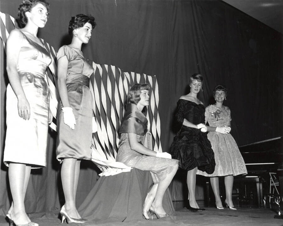 Celeste Jones, Homecoming Queen, waits to be crowned on stage along with the Homecoming princesses. Photographer Arden Literal University of Idaho Photo Center
