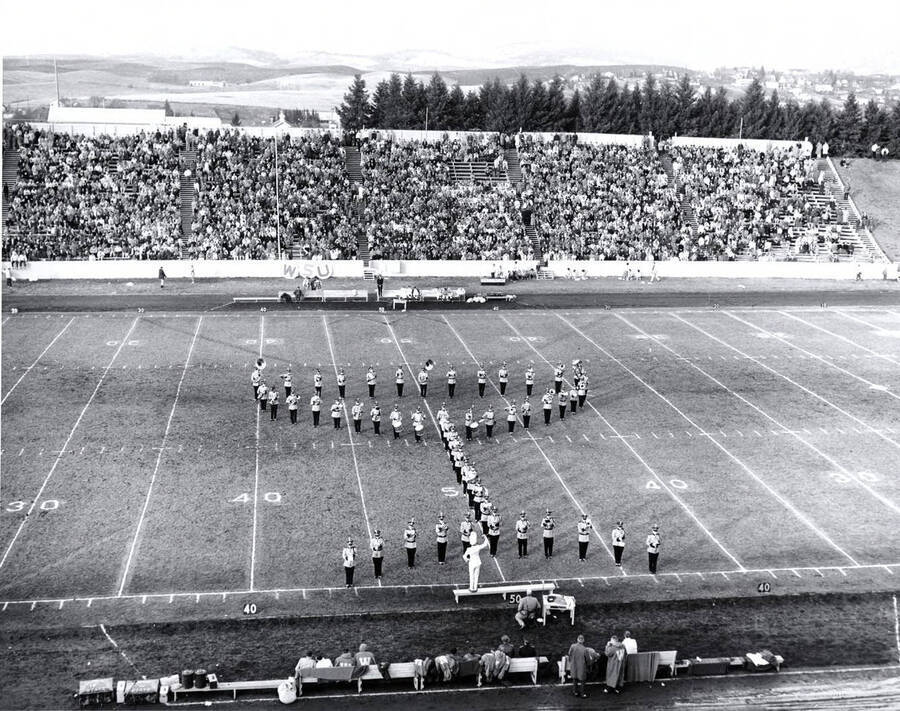 The Vandal Marching Band outlines a martini glass as part of their half-time performance during a football game against WSU.