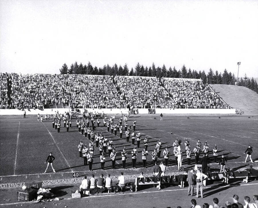 The Vandal Marching Band creates the traditional outline of a capital I during their half-time performance.