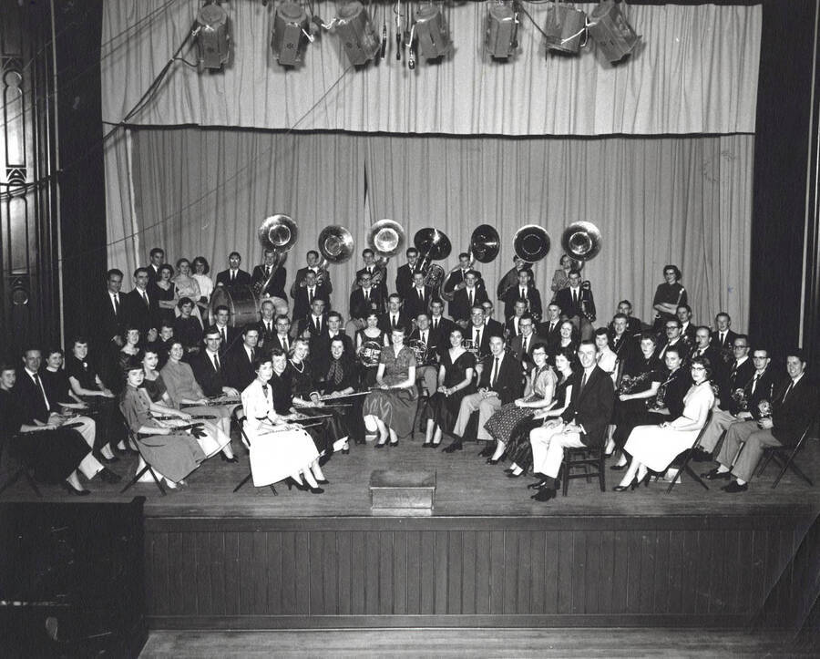 The University Concert Band sit for a group photo in the Administration Auditorium.
