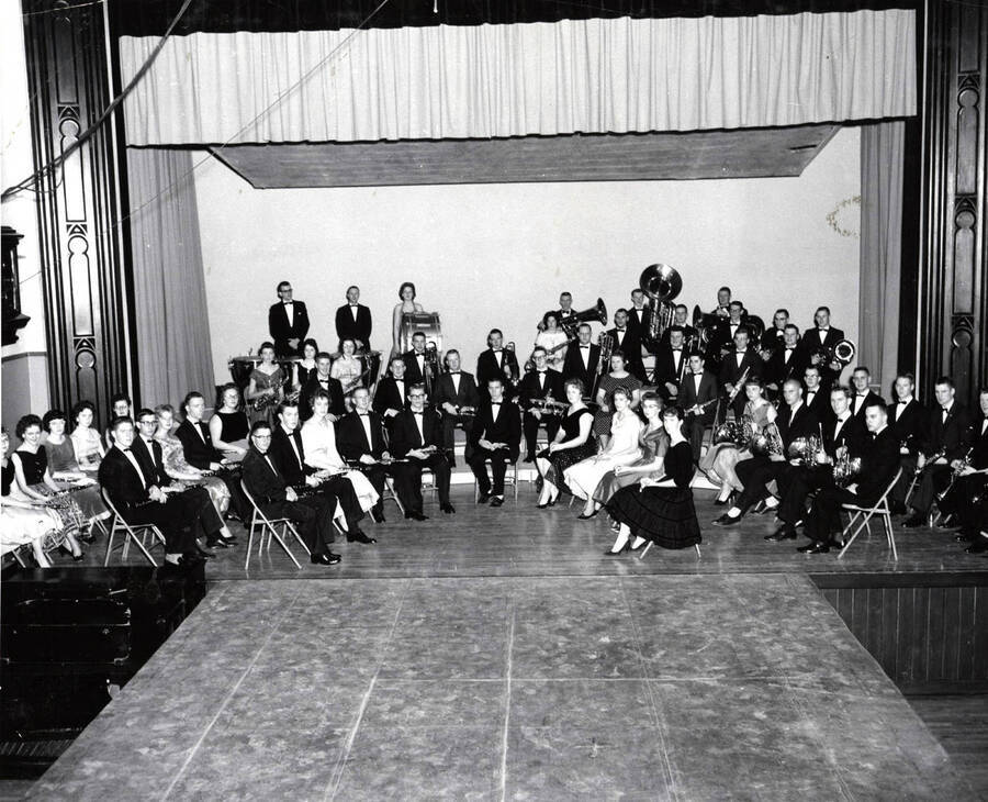 The University Concert Band sits for a group photo in the Administration Auditorium.