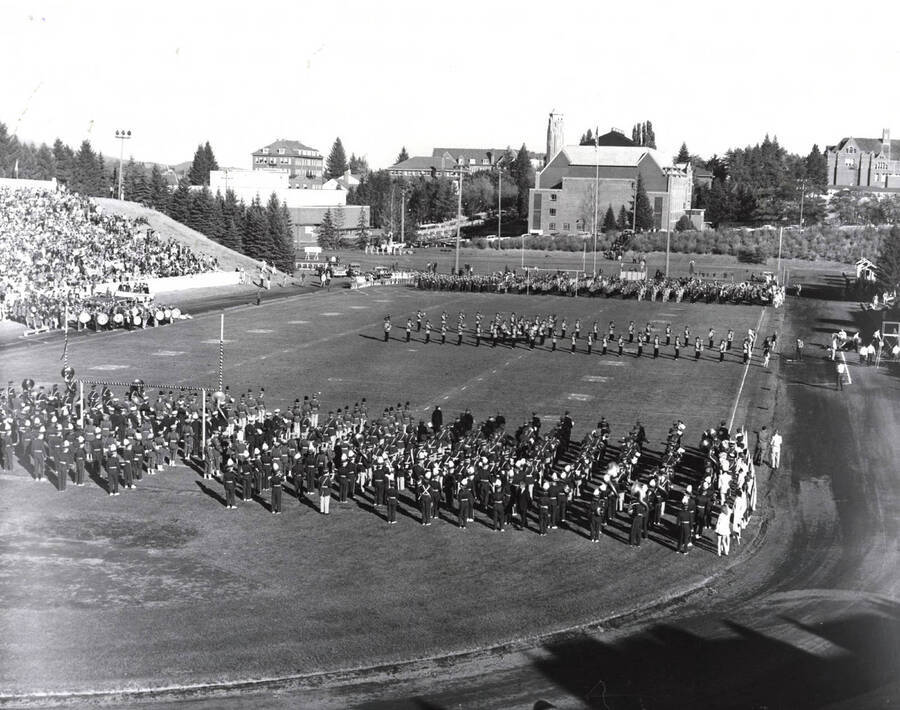 The Vandal Marching Band waits in the endzone for the University of Idaho Military Band to finish their half-time performance.
