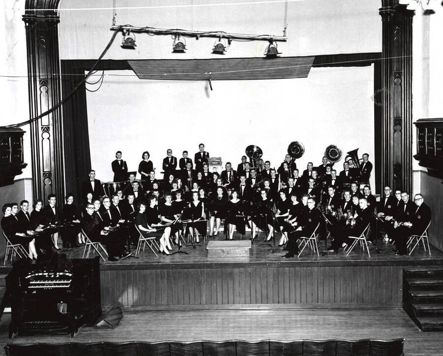 The University Concert Band sits for a group photo in the Administration Auditorium.
