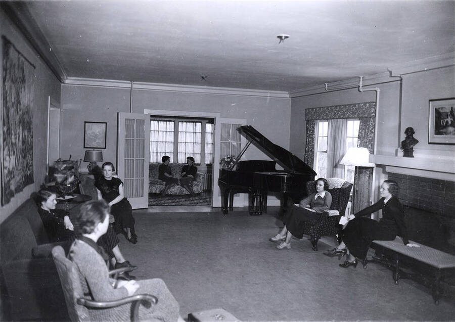 Students sit around the living room at the Delta Gamma house, which is on the northeast corner of Idaho and Elm Streets.