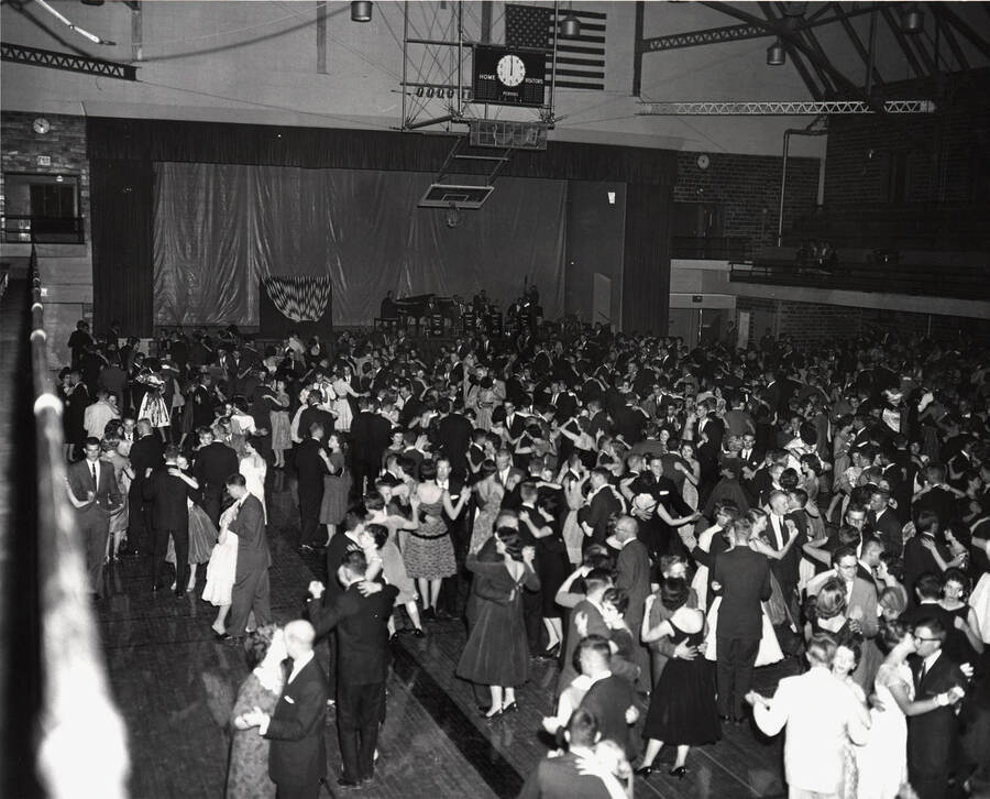 Students enjoying the Homecoming dance in the Memorial Gymnasium.