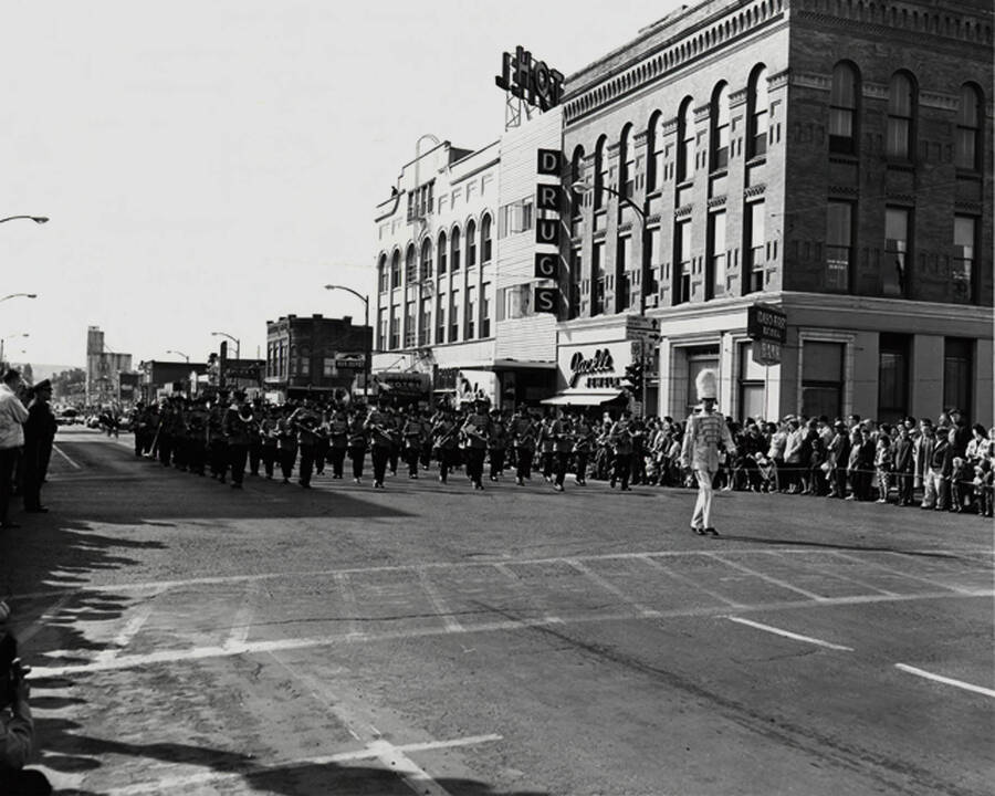 The marching band perform in front of Jackle Jewelry and Idaho First National Bank on Main St in the Homecoming parade.