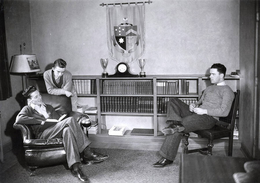 Students sit around the living room at the Delta Tau Delta house, which is at 720 Idaho.