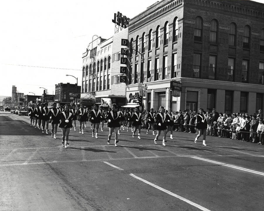 The drill team walks down Main Street in the Homecoming parade.