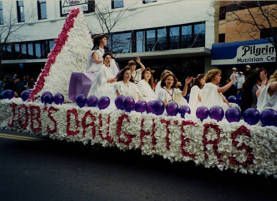 Ladies of Job's Daughters ride on a float in the Homecoming Parade.