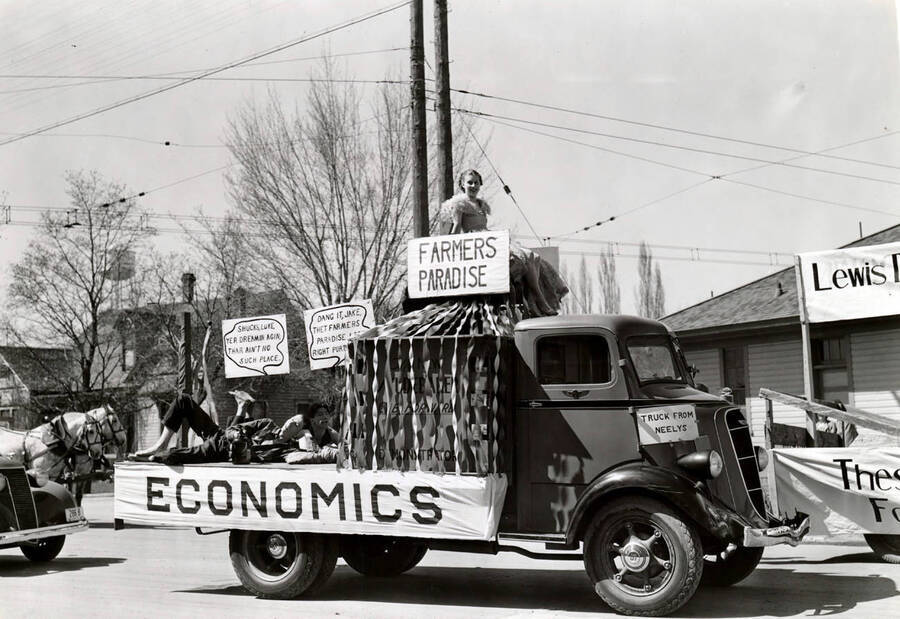 A sign reads 'farmer's paradise' on a truck labeled 'economics' during Idaho's Little International Agriculture Show.