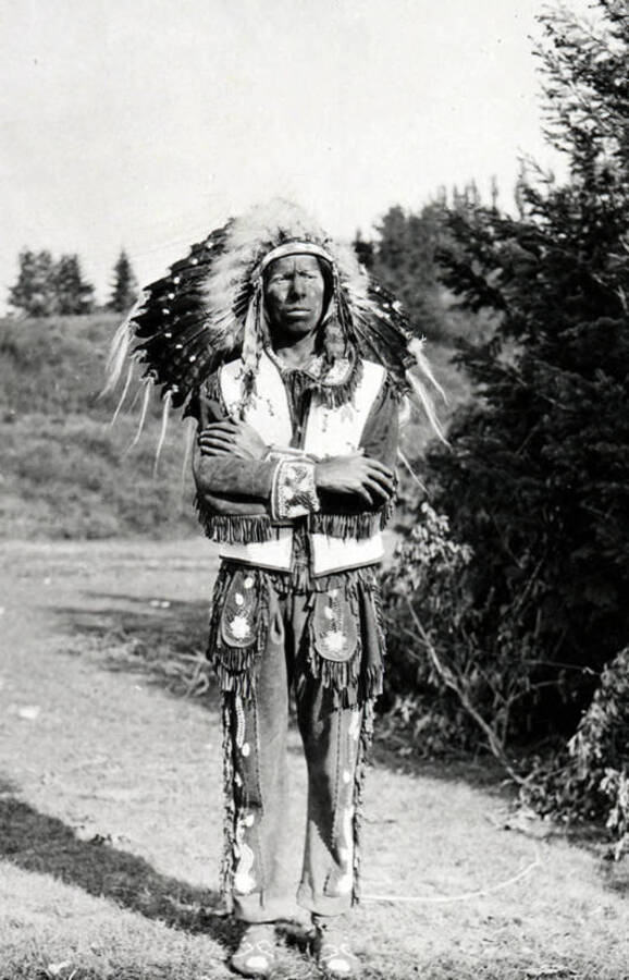 A man dressed in Native American garb for the Light on the Mountains pageant.