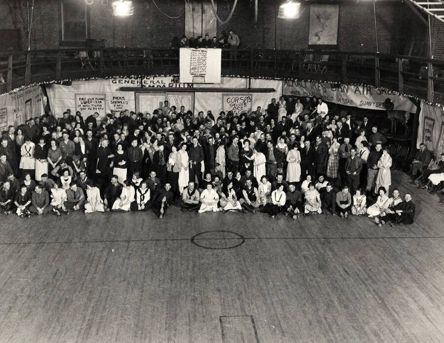 Students pose together in the women's gymnasium during the annual Muckers' Ball.