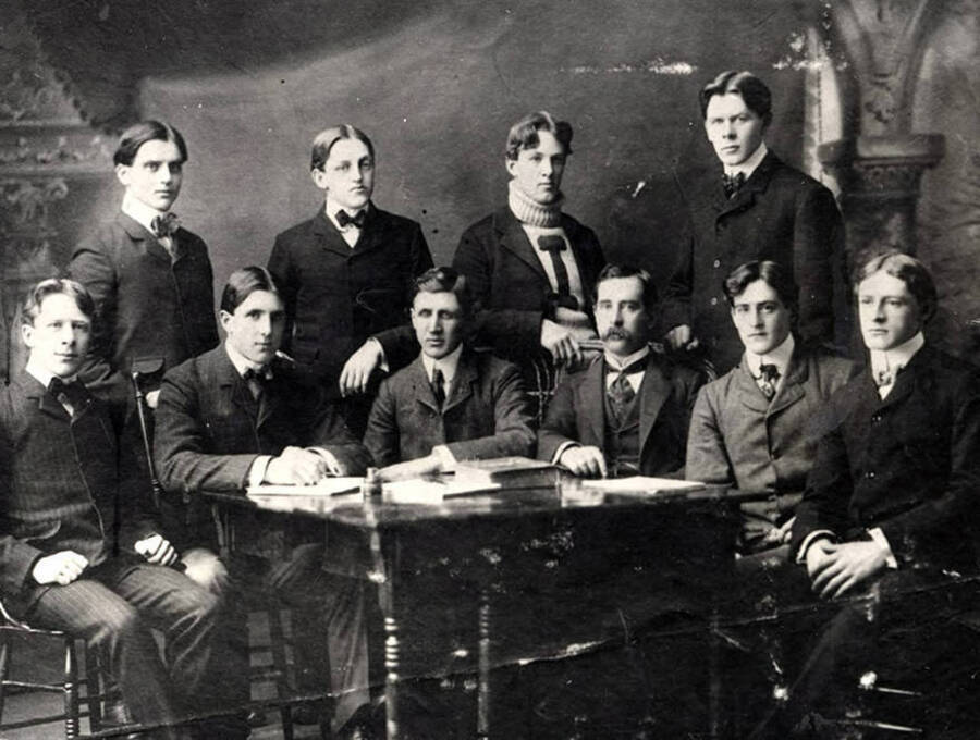 ASUI athletic board students pose around a table. Students are listed from left to right. Front row: Hal Tilly, Earl Barton, Ben Bush, Professor Bonebright, George Horton, Gus Larson. Back row: Art Strong, Robert Ghormley, Jim Gibbs, Louis Tweedt.