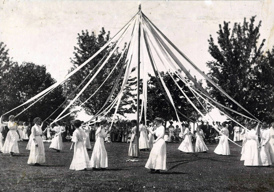 Students wind the maypole, participating in the Maypole Dance during Idaho's Campus Day festivities.