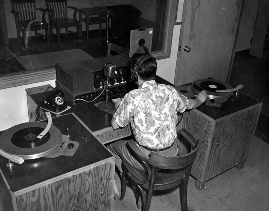 An unidentified disc jockey, sporting a Hawaiian shirt, speaks on-air in KUOI, Idaho's student-run radio studio.