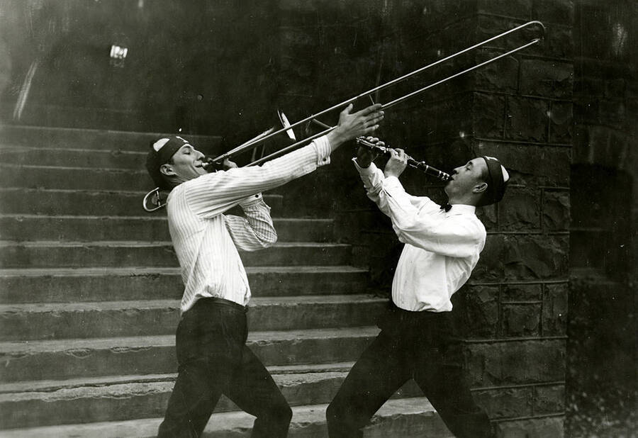 Two unidentified members of the Pep band play together. One plays the trombone and the other the clarinet.