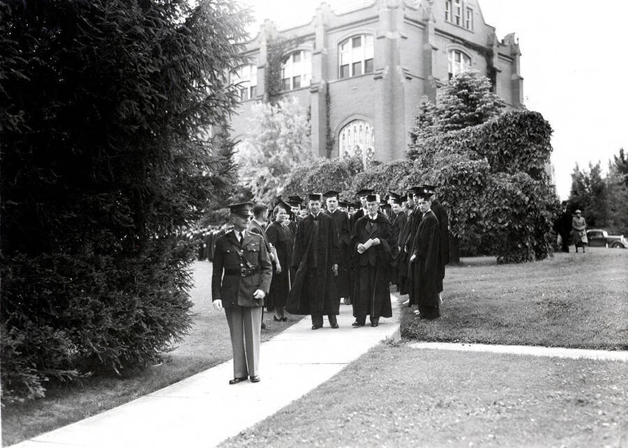 General Chrisman leads Idaho's commencement procession in front of the Administration Building.