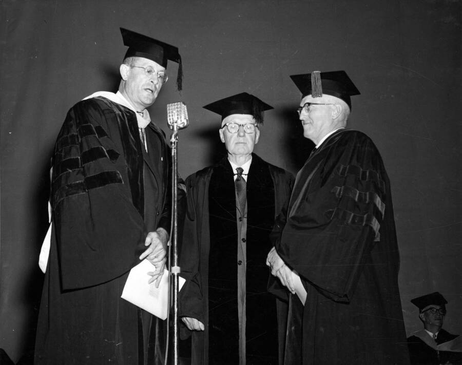 Dean Stimson and Idaho President Donald R. Theophilus stand by as Judge William Healy receives an honorary Doctorate of Law degree.