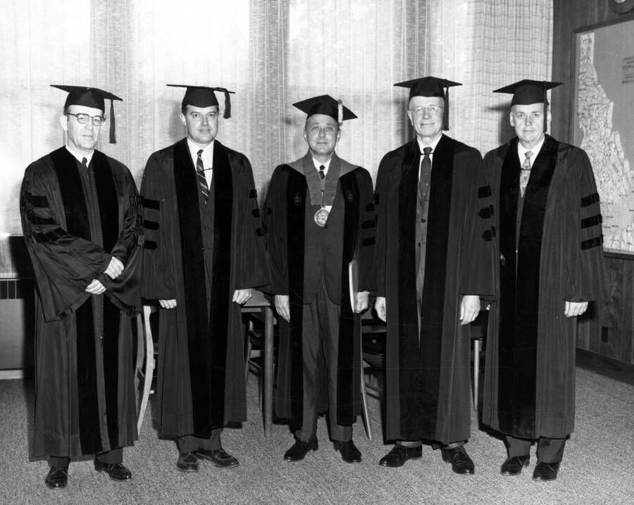Recipients of honorary degrees pose after University of Idaho's commencement. From left to right: D. R. deBoisblanc, Frank Church, Lyman D. Wilbur, and Dr. George M. Jemison with U of I President, Ernest W. Hartung in center.