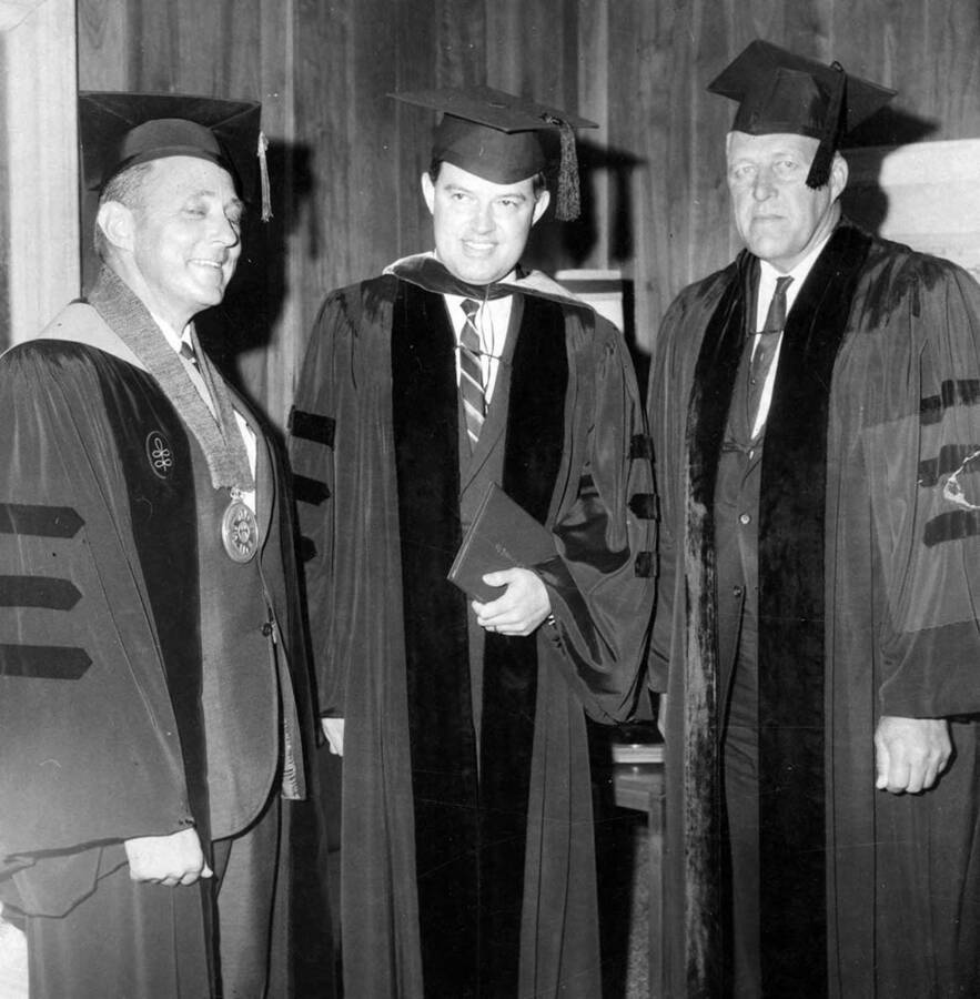 Senator Church stands with University of Idaho President Ernest W. Hartung and Governor Don Samuelson after receiving his honorary Doctor of Law degree.