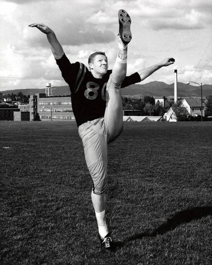 Football player Reg Carolan (end) showing off his kicking form at the University of Idaho.