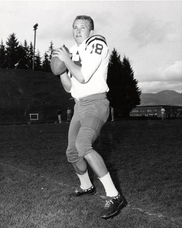 Football player Mike Mosolf (quarterback) preparing to throw the ball.