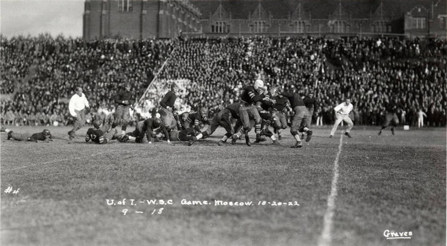 A photo taken during a University of Idaho vs. Washington State College football game with a caption that reads, 'U. of I. - W.S.C. Game. Moscow. 10-20-22, #4, 9-18.'
