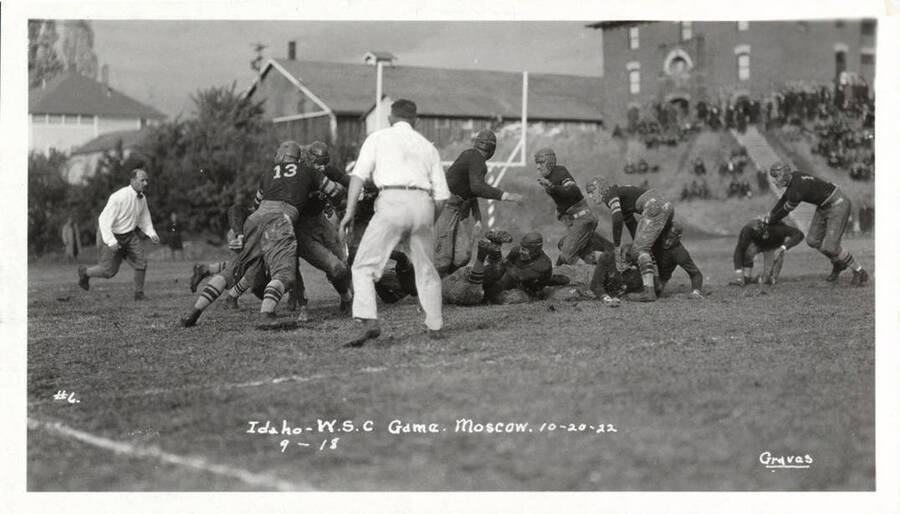A photo taken during a University of Idaho vs. Washington State College football game with a caption that reads, 'U. of I. - W.S.C. Game. Moscow. 10-20-22, #6, 9-18.'