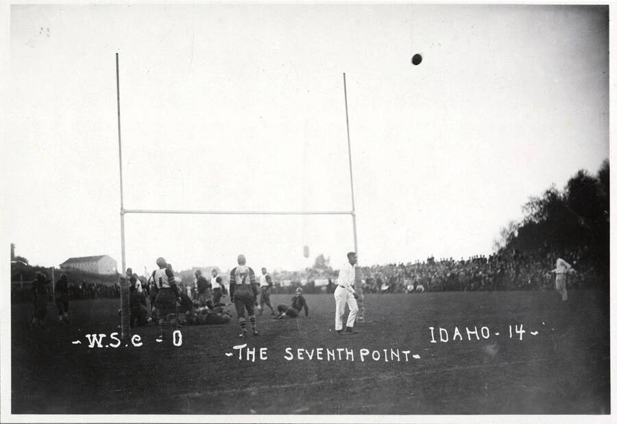 A photo taken during a University of Idaho vs. Washington State College football game with a caption that reads, 'W.S.C.-0 ~The Seventh Point~  Idaho-14.'
