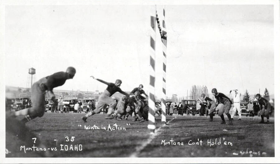 Action shot during the Idaho vs. Montana football game at the University of Idaho. Caption reads 'Montana-7 vs. Idaho-35, 'Heintz in Action', Montana Can't Hold 'Em'